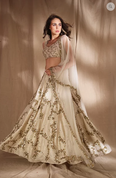 Astha Narang Ivory and Gold Lehenga - The Grand Trunk